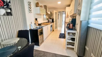 kitchen-with-all-appliances-and-dining-area