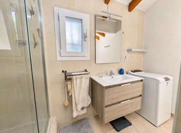 modern-bathroom-with-a-wash-area-and-wooden-f