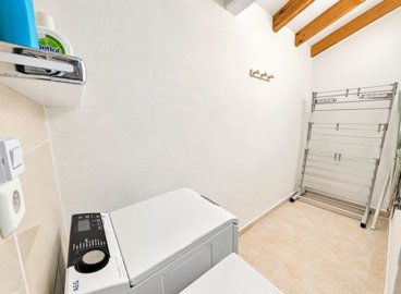 bright-utility-room-with-a-washing-machine