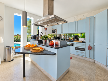 modern-kitchen-with-island-and-pool-views--be