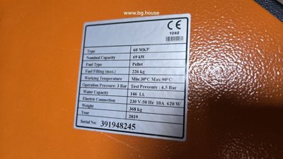 Technical label on orange heating unit detailing type, capacity, fuel type, and electrical connection